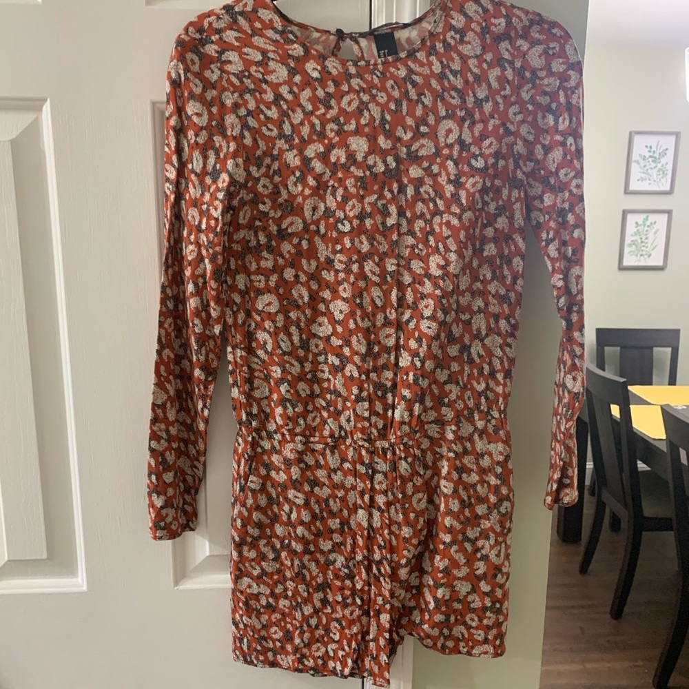 Red and white patterned long sleeve romper